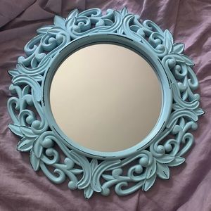 Round mirror with blue design frame